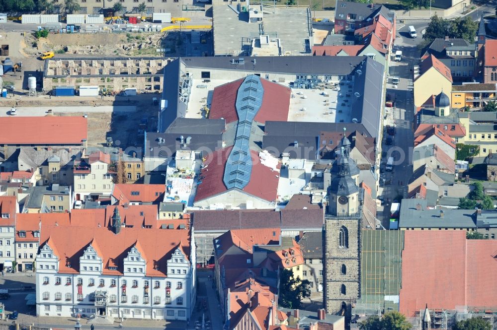 Wittenberg from the bird's eye view: View of the construction site of the shopping center Arsenal between the Arsenal square and the market place in the inner city of Wittenberg. Project developers are MIB AG and the OFB Development GmbH. The completion is scheduled for autumn 2012