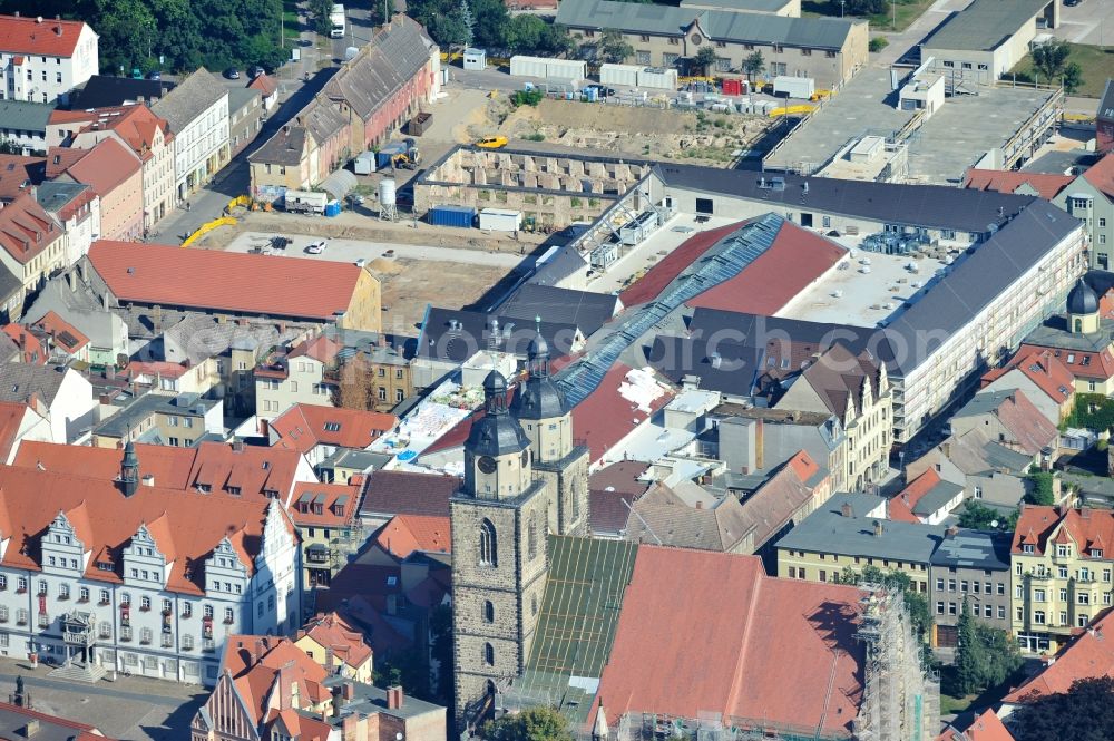 Aerial photograph Wittenberg - View of the construction site of the shopping center Arsenal between the Arsenal square and the market place in the inner city of Wittenberg. Project developers are MIB AG and the OFB Development GmbH. The completion is scheduled for autumn 2012