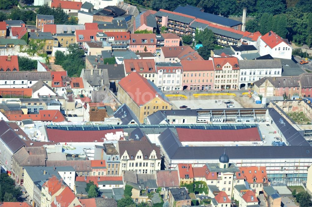 Wittenberg from the bird's eye view: View of the construction site of the shopping center Arsenal between the Arsenal square and the market place in the inner city of Wittenberg. Project developers are MIB AG and the OFB Development GmbH. The completion is scheduled for autumn 2012