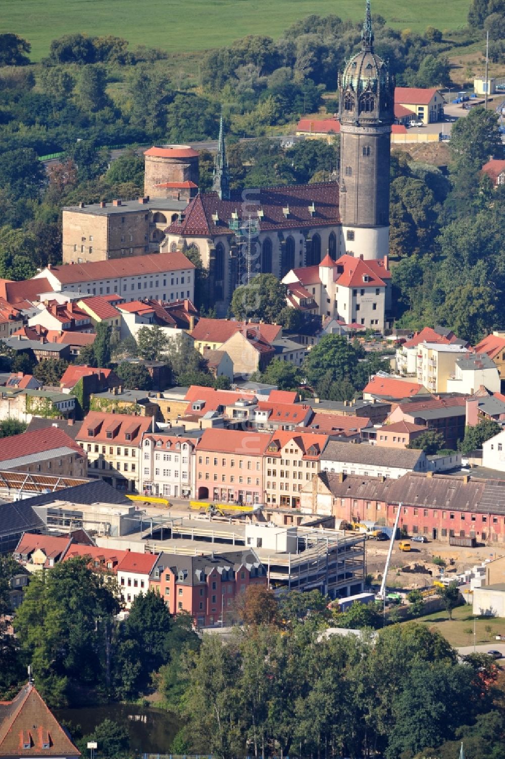 Wittenberg from above - View of the construction site of the shopping center Arsenal between the Arsenal square and the market place in the inner city of Wittenberg. Project developers are MIB AG and the OFB Development GmbH. The completion is scheduled for autumn 2012