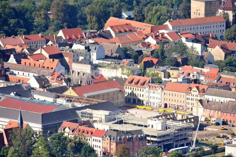 Aerial photograph Wittenberg - View of the construction site of the shopping center Arsenal between the Arsenal square and the market place in the inner city of Wittenberg. Project developers are MIB AG and the OFB Development GmbH. The completion is scheduled for autumn 2012