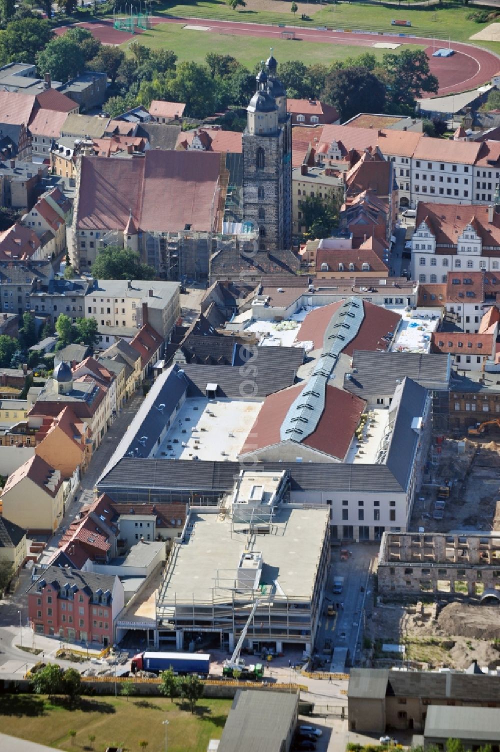 Wittenberg from the bird's eye view: View of the construction site of the shopping center Arsenal between the Arsenal square and the market place in the inner city of Wittenberg. Project developers are MIB AG and the OFB Development GmbH. The completion is scheduled for autumn 2012