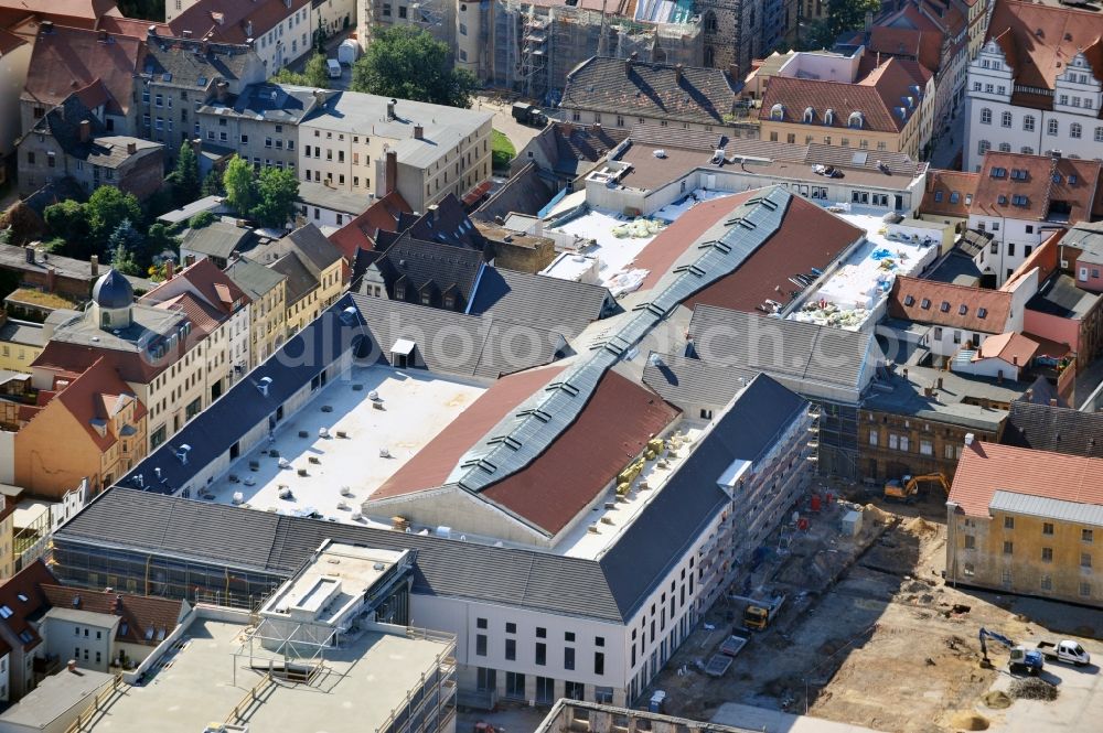 Aerial photograph Wittenberg - View of the construction site of the shopping center Arsenal between the Arsenal square and the market place in the inner city of Wittenberg. Project developers are MIB AG and the OFB Development GmbH. The completion is scheduled for autumn 2012