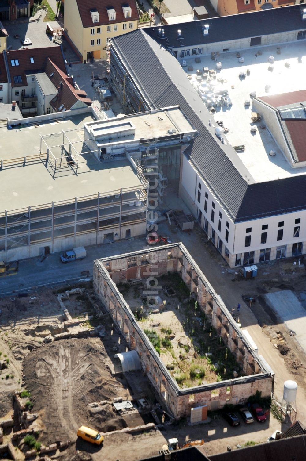 Wittenberg from above - View of the construction site of the shopping center Arsenal between the Arsenal square and the market place in the inner city of Wittenberg. Project developers are MIB AG and the OFB Development GmbH. The completion is scheduled for autumn 2012