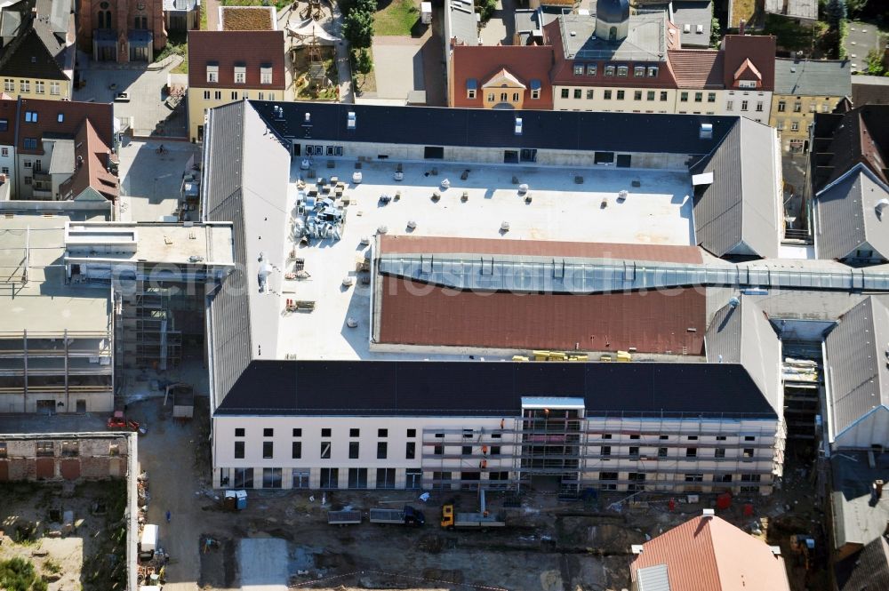 Wittenberg from the bird's eye view: View of the construction site of the shopping center Arsenal between the Arsenal square and the market place in the inner city of Wittenberg. Project developers are MIB AG and the OFB Development GmbH. The completion is scheduled for autumn 2012