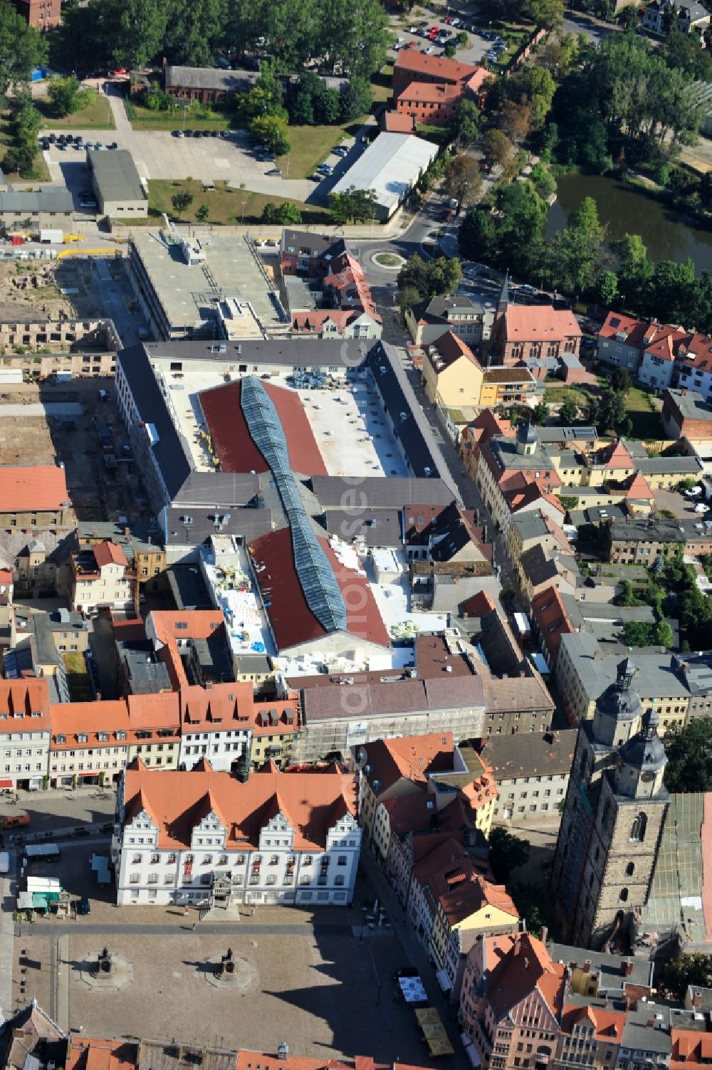 Wittenberg from the bird's eye view: View of the construction site of the shopping center Arsenal between the Arsenal square and the market place in the inner city of Wittenberg. Project developers are MIB AG and the OFB Development GmbH. The completion is scheduled for autumn 2012