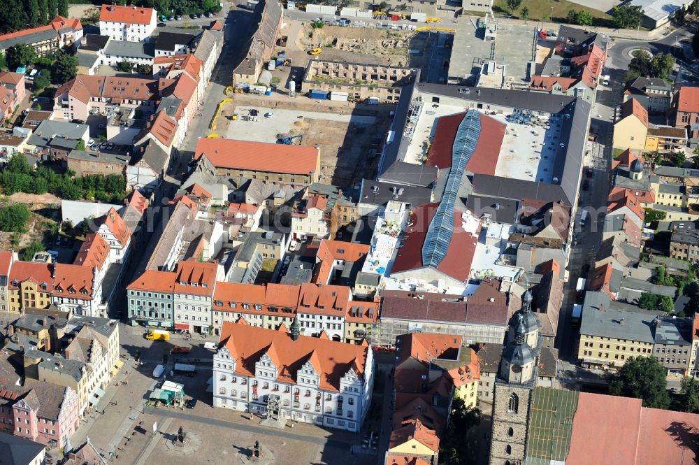 Aerial photograph Wittenberg - View of the construction site of the shopping center Arsenal between the Arsenal square and the market place in the inner city of Wittenberg. Project developers are MIB AG and the OFB Development GmbH. The completion is scheduled for autumn 2012