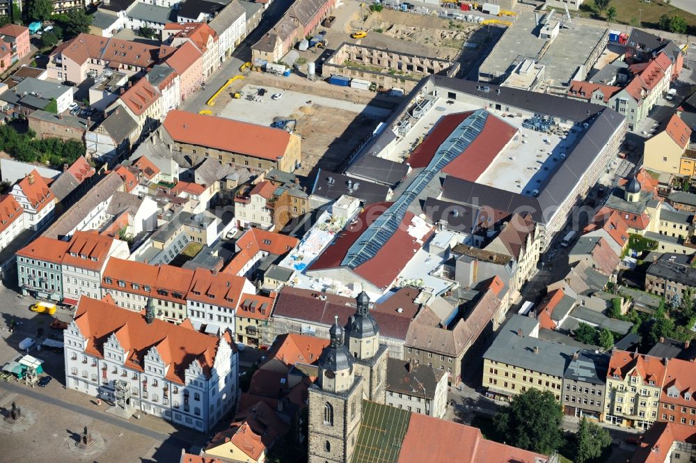 Wittenberg from the bird's eye view: View of the construction site of the shopping center Arsenal between the Arsenal square and the market place in the inner city of Wittenberg. Project developers are MIB AG and the OFB Development GmbH. The completion is scheduled for autumn 2012