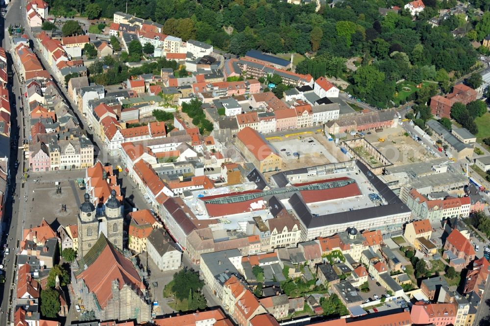 Aerial photograph Wittenberg - View of the construction site of the shopping center Arsenal between the Arsenal square and the market place in the inner city of Wittenberg. Project developers are MIB AG and the OFB Development GmbH. The completion is scheduled for autumn 2012