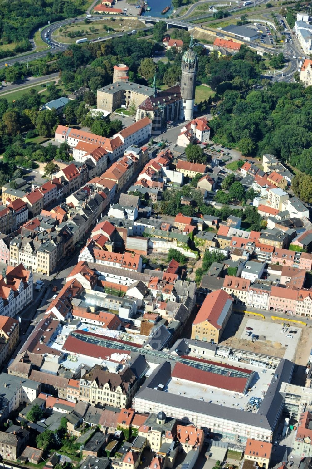 Wittenberg from the bird's eye view: View of the construction site of the shopping center Arsenal between the Arsenal square and the market place in the inner city of Wittenberg. Project developers are MIB AG and the OFB Development GmbH. The completion is scheduled for autumn 2012