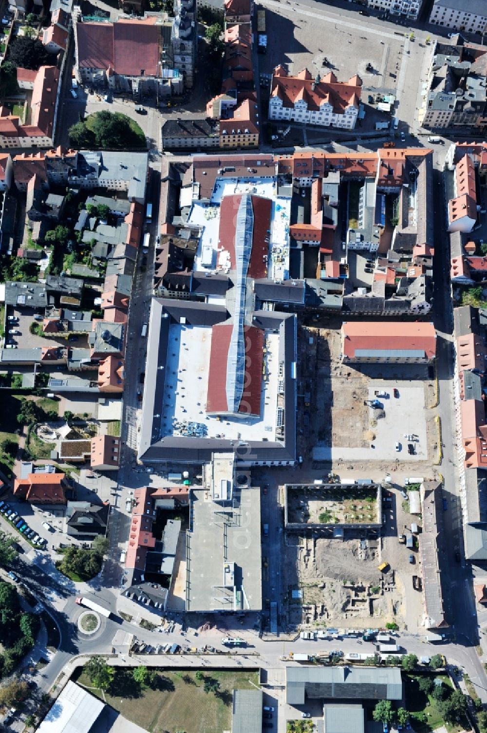 Aerial photograph Wittenberg - View of the construction site of the shopping center Arsenal between the Arsenal square and the market place in the inner city of Wittenberg. Project developers are MIB AG and the OFB Development GmbH. The completion is scheduled for autumn 2012