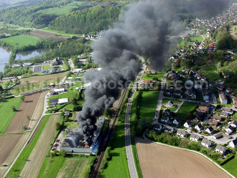 Wehr from the bird's eye view: Large fire at a warehouse in Wehr in the state of Baden-Wuerttemberg. By arson burn tires with black smoke