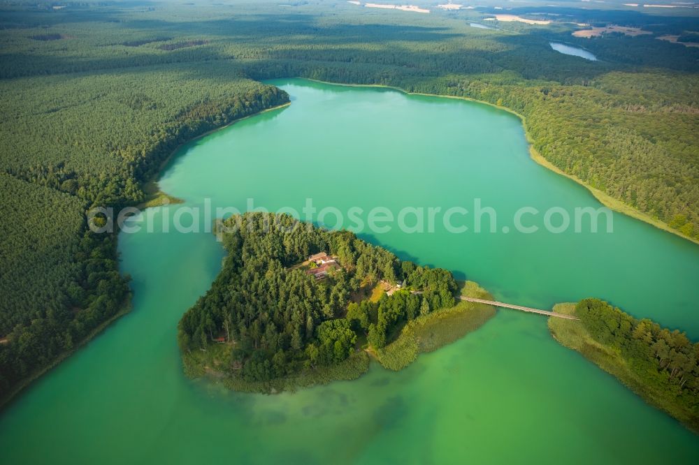 Wokuhl-Dabelow from above - Lake Grosser Brueckentinsee with its island and green water in the nature park Feldberger Seenlandschaft in Wokuhl-Dabelow in the state of Mecklenburg - Western Pomerania. The Island Hotel Brueckentinsee is located on the island