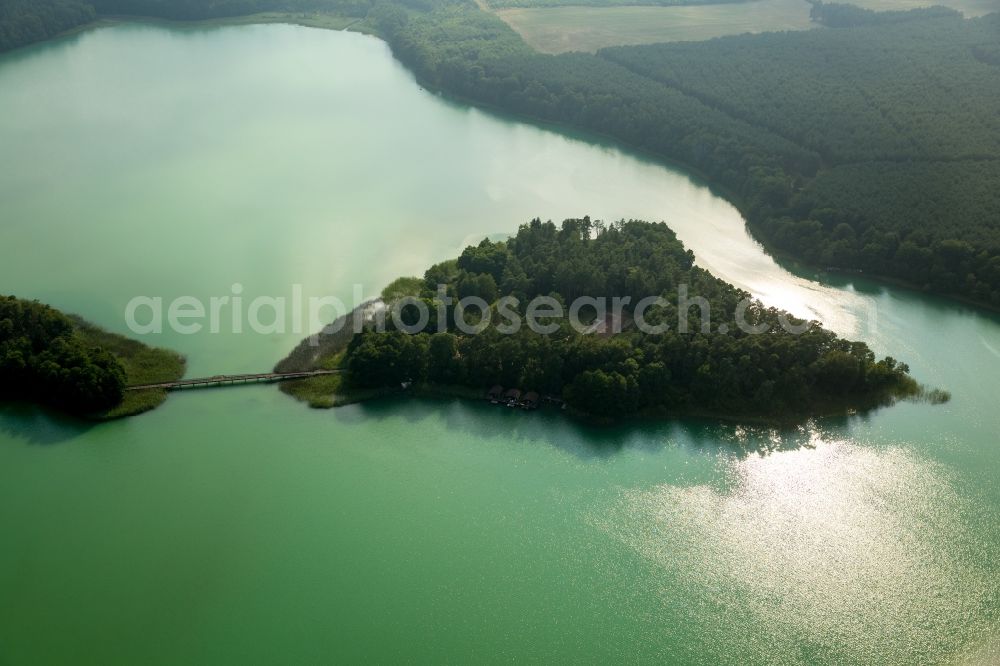 Wokuhl-Dabelow from above - Lake Grosser Brueckentinsee with its island and green water in the nature park Feldberger Seenlandschaft in Wokuhl-Dabelow in the state of Mecklenburg - Western Pomerania. The Island Hotel Brueckentinsee is located on the island