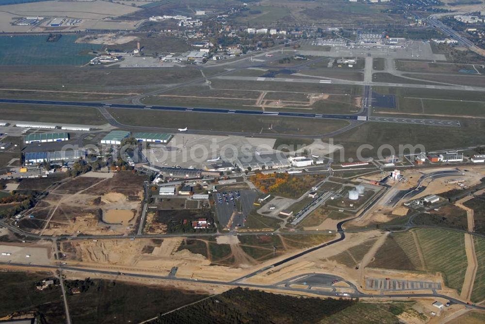 Schönefeld from above - Blick auf die Ausbauarbeiten am Hauptstadt-Airport Berlin Brandenburg International BBI. Ab dem 1. November 2011 sollen dort über 22 bis 25 Millionen Passagiere pro Jahr abgefertigt werden können. In einer zweiten Ausbaustufe sollen auch 40 Millionen Passagiere möglich sein. Geplant ist ein 220 Meter langes Zentralterminal sowie eine nördliche Landebahn, die aus der alten südlichen Landebahn des heutigen Flughafens ensteht.