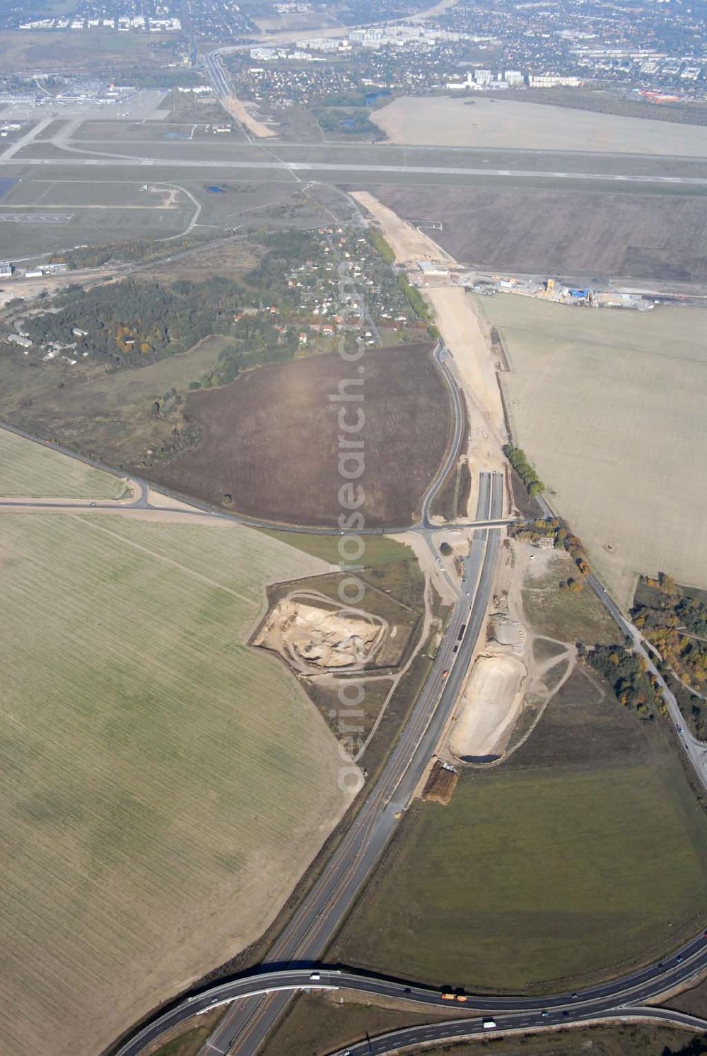 Aerial image Schönefeld - Blick auf die Verlängerung der Autobahn A 113 zwischen dem Stadtring und dem in Planung befindlichen Hauptstadt-Airport Berlin Brandenburg International BBI durch die Schälerbau Berlin GmbH an der Freiheit 10 in 13597 Berlin - Telefon +49 (0)30 35 187 03 - Fax +49 (0)30 35 187 398 - Mail info@schaelerbau.de ; Klähne & Bauchspieß - Beratende Ingenieure im Bauwesen GmbH, Inselstraße 6A, 10179 Berlin ; Ingenieurbüro Meyer + Schubart, Blumenauer Straße 10, 31515 Wunstorf