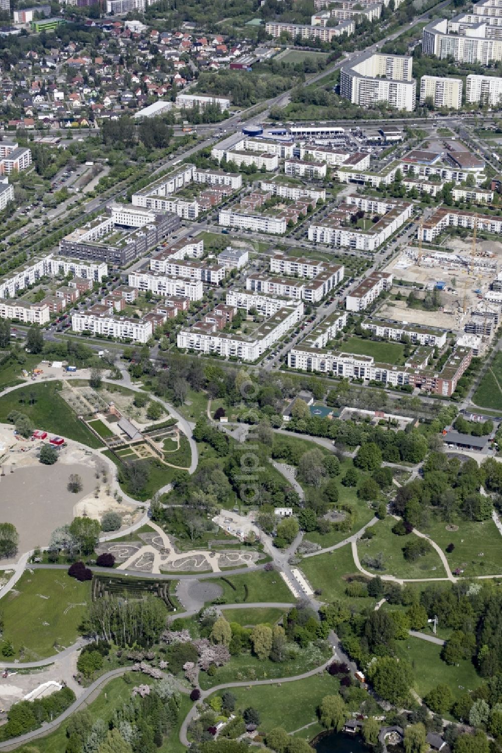 Berlin from above - Gaerten der Welt park on the premises of the IGA 2017 in the district of Marzahn-Hellersdorf in Berlin. Residential buildings and estates are located in the background along Eisenacher Strasse