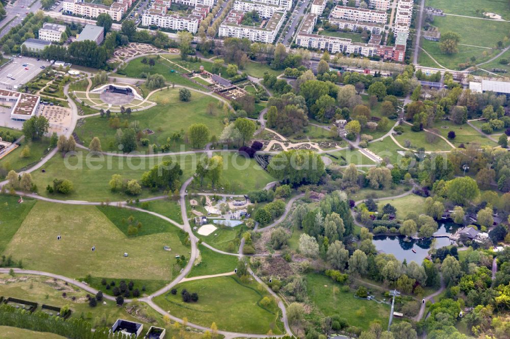 Berlin from the bird's eye view: Gaerten der Welt park on the premises of the IGA 2017 in the district of Marzahn-Hellersdorf in Berlin. Residential buildings and estates are located in the background along Eisenacher Strasse