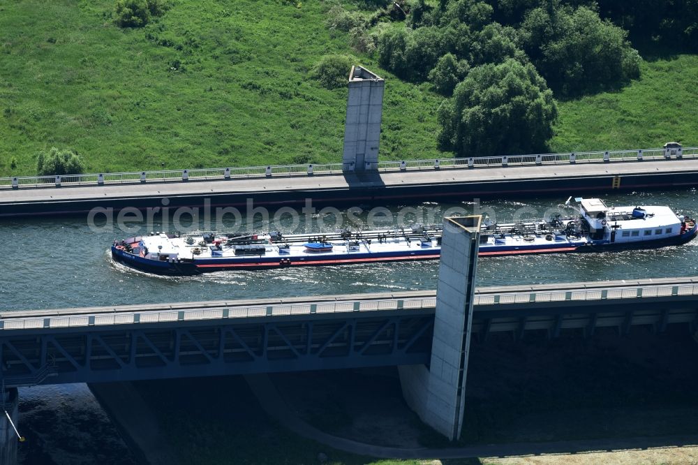 Aerial image Hohenwarthe - Freight ship under way on the Trough bridge from the Mittelland Canal over the River Elbe to the Elbe-Havel Canal to the waterway intersection in Hohenwarthe in Saxony-Anhalt