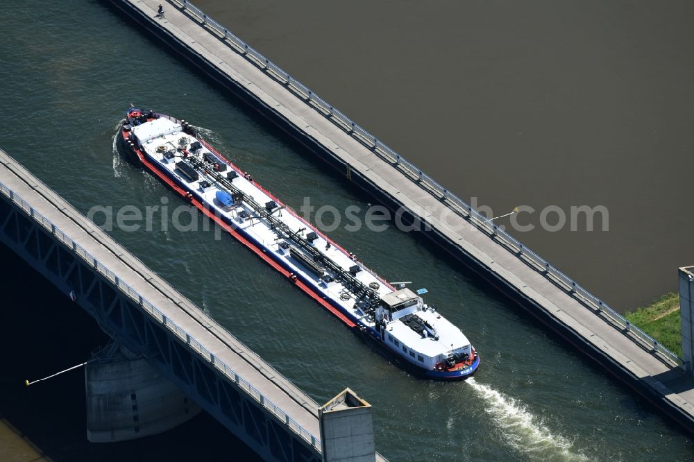 Hohenwarthe from above - Freight ship under way on the Trough bridge from the Mittelland Canal over the River Elbe to the Elbe-Havel Canal to the waterway intersection in Hohenwarthe in Saxony-Anhalt