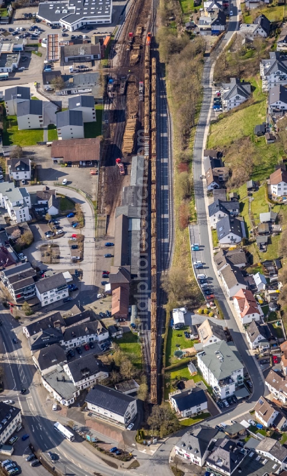 Aerial image Sundern - Loading of wagons fuer einen Holztransport of a train in freight traffic on the track in Sundern (Sauerland) at Sauerland in the state North Rhine-Westphalia, Germany