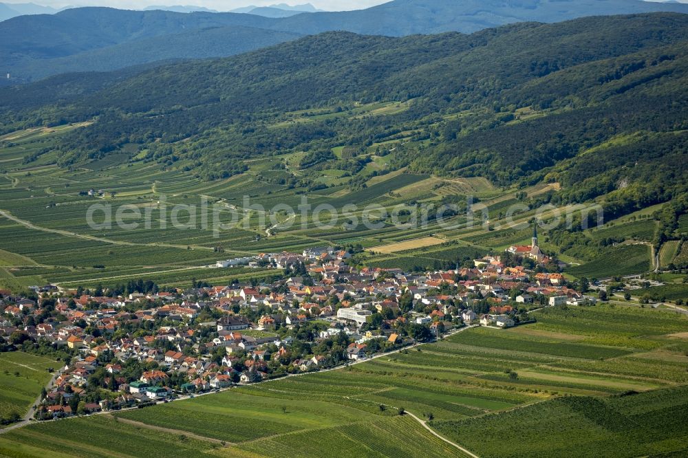 Aerial photograph Guntramsdorf - The municipality Guntramsdorf in front of the hill Eichkogel in the state Lower Austria in Austria. The municipality is surrounded by fields
