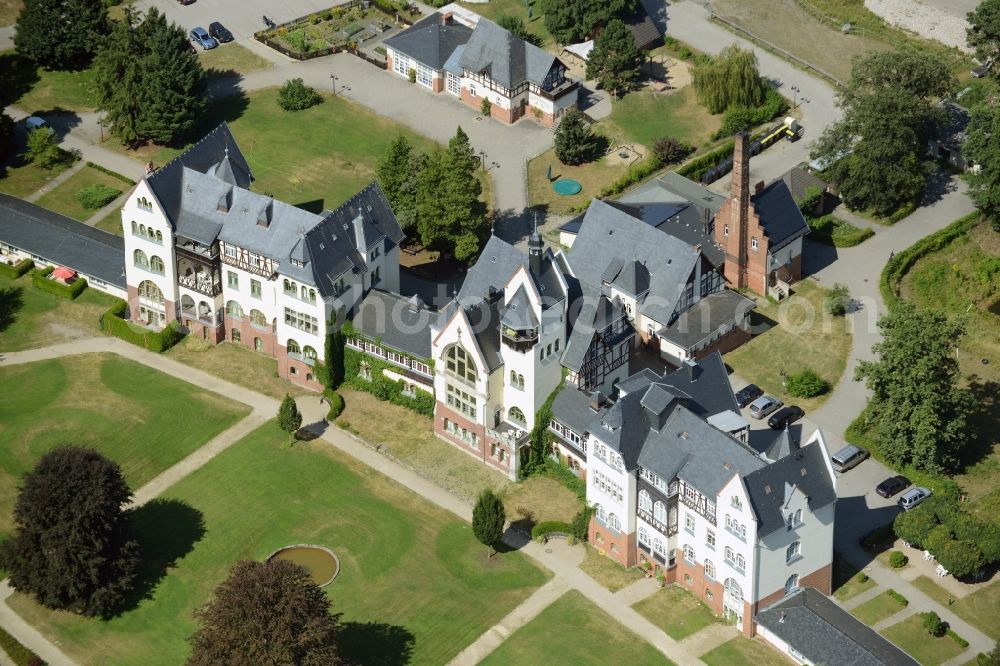 Müllrose from above - Zeisigberg estate in Muellrose in the state of Brandenburg. The historic building complex was opened as a sanatorium for consumptives in 1907 and is being run by the development office for health and social issues as a care home, children`s facility and home for the elderly