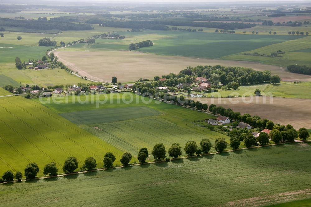 Vipperow from above - Building complex of the manor house Solzow surrounded by green fields next to the park Gutshaus Solzow in the Lange Strasse in Vipperow in Mecklenburg-Western Pomerania