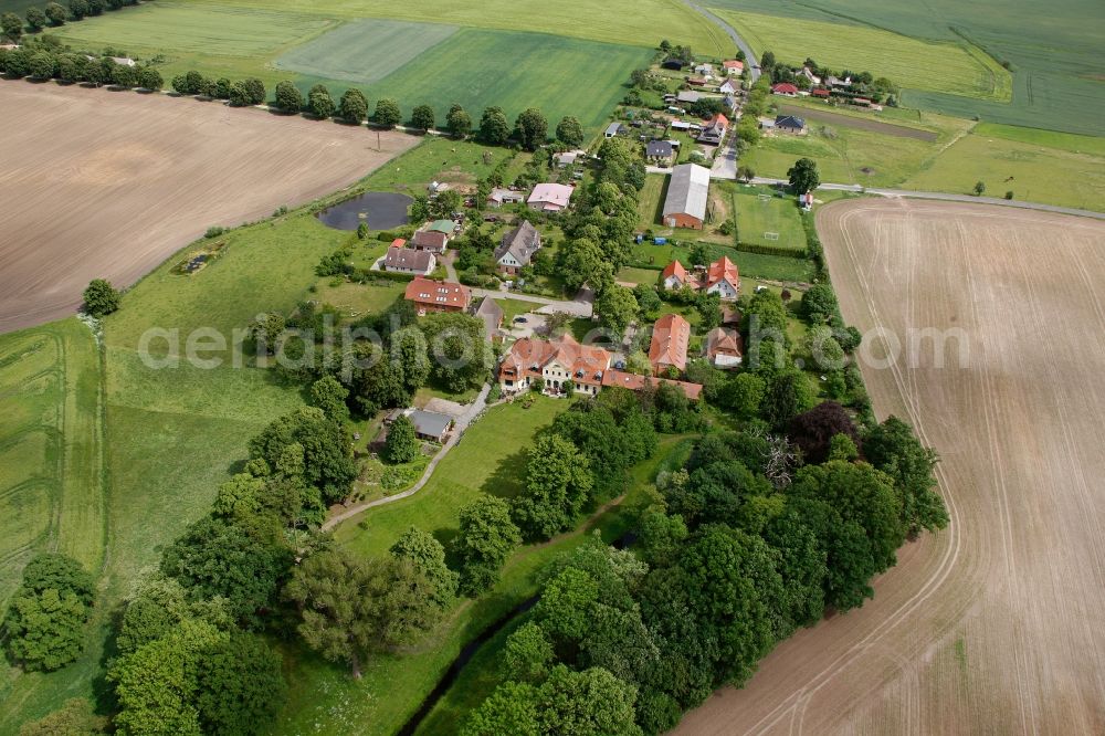 Aerial photograph Vipperow - Building complex of the manor house Solzow surrounded by green fields next to the park Gutshaus Solzow in the Lange Strasse in Vipperow in Mecklenburg-Western Pomerania