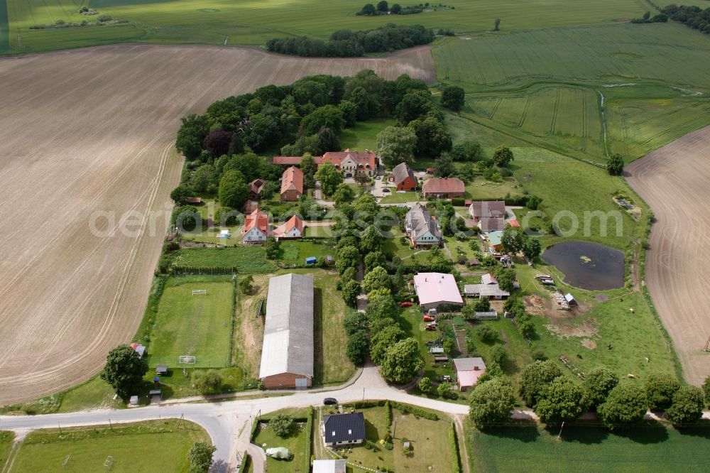 Vipperow from above - Building complex of the manor house Solzow surrounded by green fields next to the park Gutshaus Solzow in the Lange Strasse in Vipperow in Mecklenburg-Western Pomerania