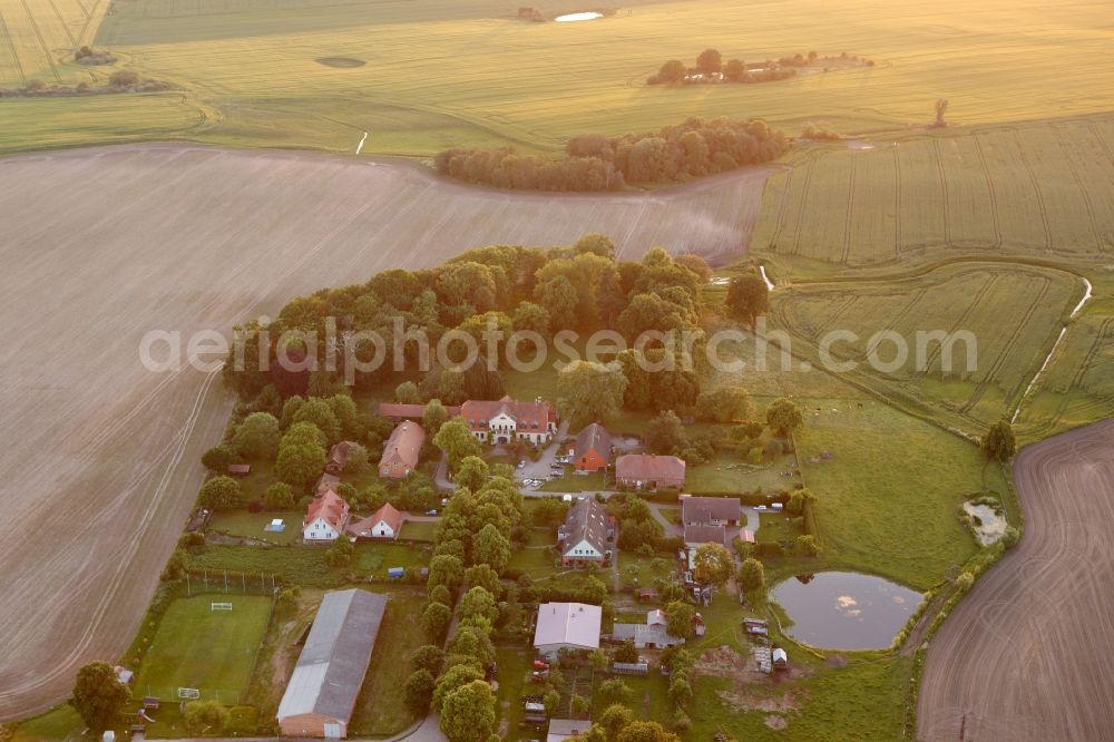 Vipperow from the bird's eye view: Building complex of the manor house Solzow surrounded by green fields next to the park Gutshaus Solzow in the Lange Strasse in Vipperow in Mecklenburg-Western Pomerania