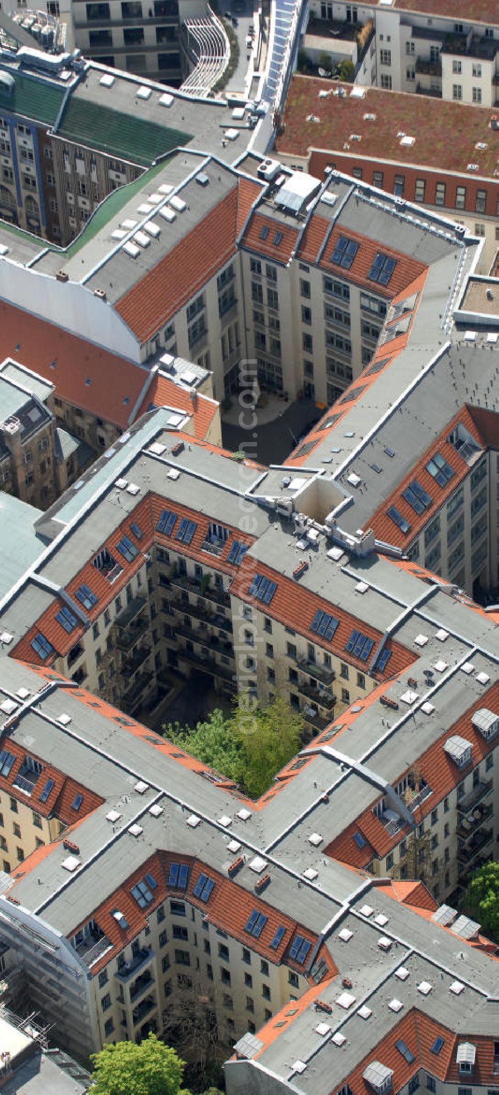 Berlin from the bird's eye view: Blick auf die Hackeschen Höfe an der Rosenthaler Strasse in Berlin-Mitte. Die Hackeschen Höfe sind Deutschlands größtes geschlossenes Hofareal. Im Zuge der Sanierung Mitte der 90er Jahre erlebten die Höfe eine Renaissance ihres ursprünglichen Konzeptes der Mischnutzung durch Kunst, Kultur, Wohnen, Gewerbe und Gastronomie. View of the Hackesche Höfe at the Rosenthaler Strasse in Berlin-Mitte. The area are Germany's largest enclosed courtyard area. During the refurbishment in the mid 90s saw a renaissance of the courts of their original concept of mixed use by art, culture, housing, trade and catering. PENTANEX GmbH