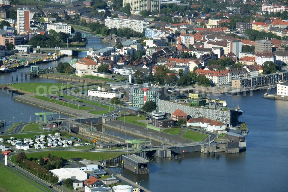 Bremerhaven from above - Harbour area of the South of Bremerhaven in the state of Bremen. View of the harbour on the Weser riverbank with the New Watergate in the foreground