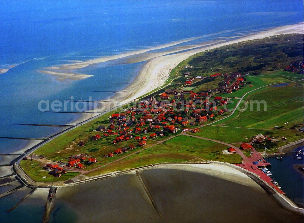 Baltrum from above - View of the municipality and harbor of the smallest East Frisian Island Baltrum in the state Lower Saxony. Part of the barrier island and the surrounding mudflat are part of the national park Wadden Sea of Lower Saxony. As a bathing resort and therapeutic spa the island is a popular destination for tourists