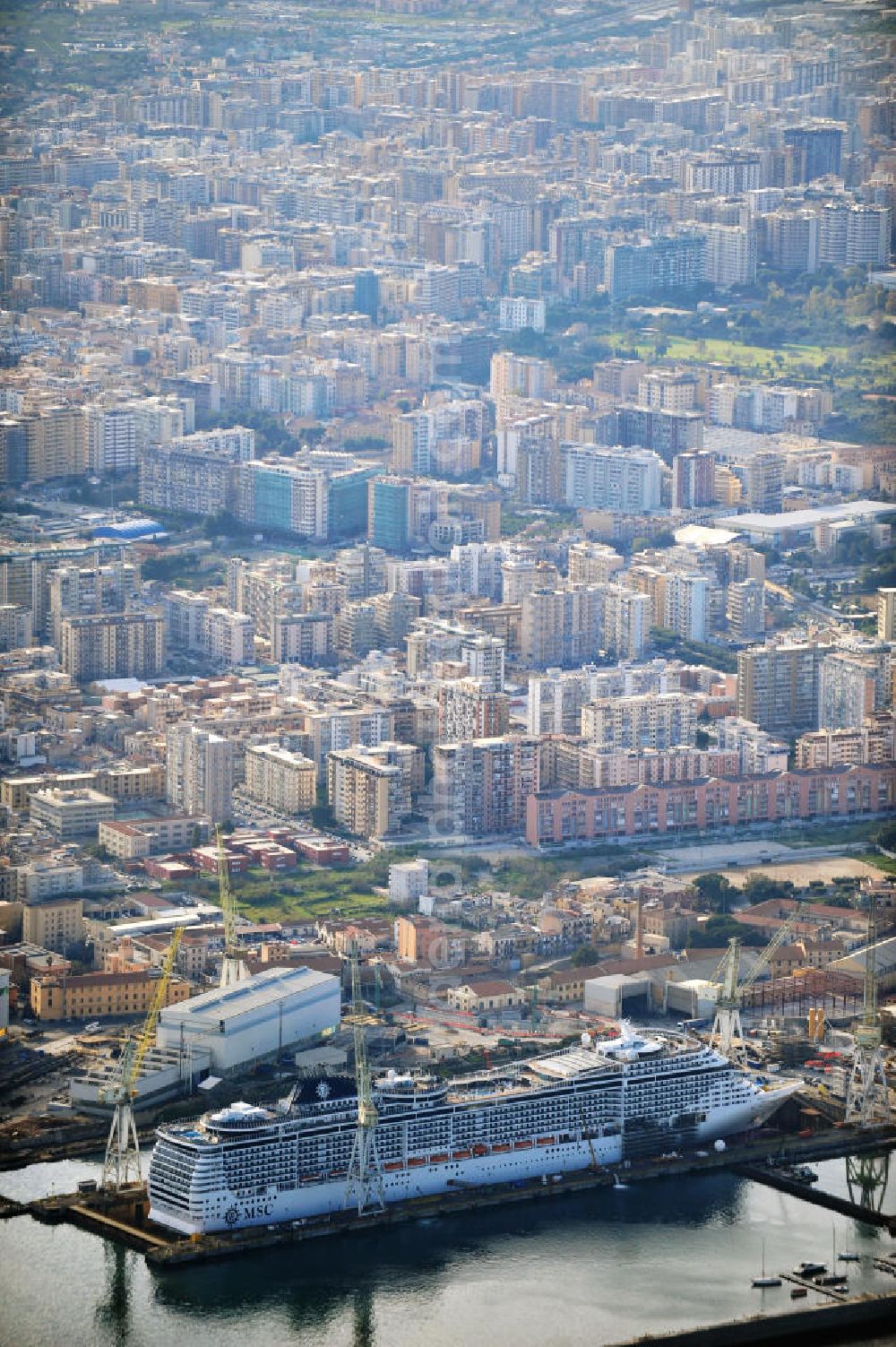 Aerial photograph Palermo Sizilien - Fincantierii yard with the cruise ship MSC Splendida, of the Italian shipping company MSC Crociers S.A. for the overhaul at the dry dock of the shipyard in Palermo, Sicily, Italy