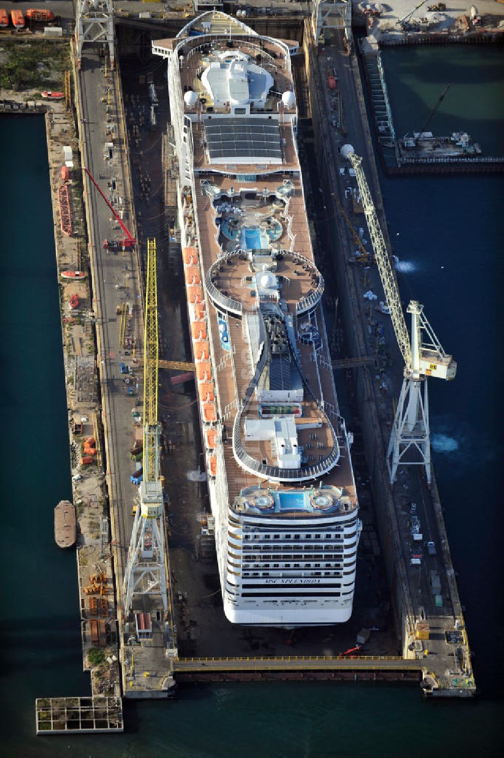 Palermo Sizilien from the bird's eye view: Fincantierii yard with the cruise ship MSC Splendida, of the Italian shipping company MSC Crociers S.A. for the overhaul at the dry dock of the shipyard in Palermo, Sicily, Italy