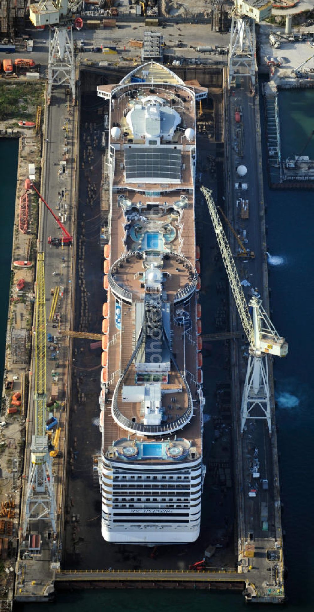 Aerial image Palermo Sizilien - Fincantierii yard with the cruise ship MSC Splendida, of the Italian shipping company MSC Crociers S.A. for the overhaul at the dry dock of the shipyard in Palermo, Sicily, Italy