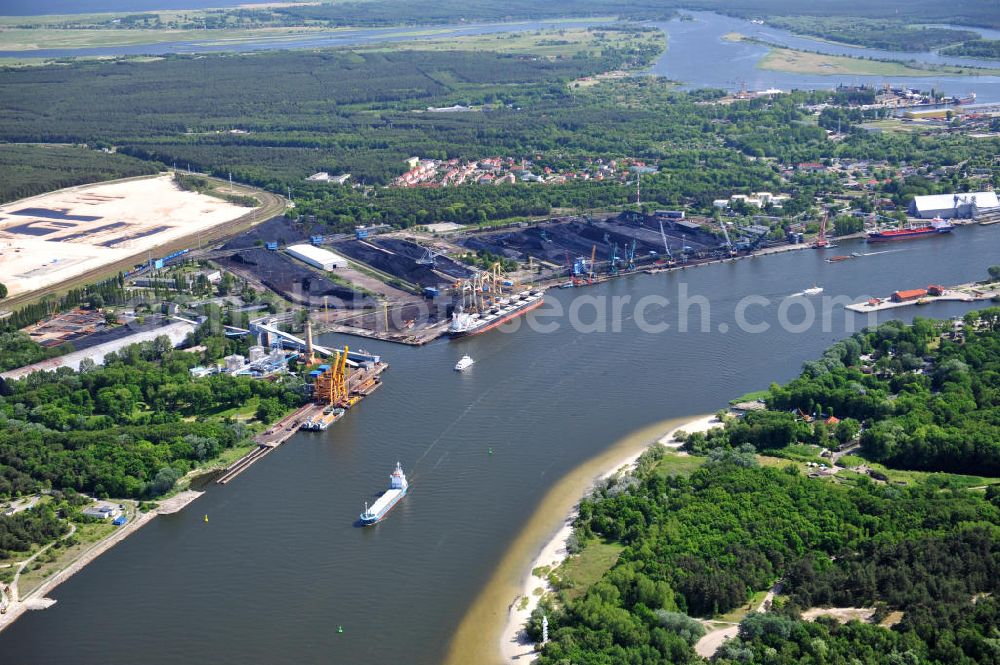 Aerial image SWINEMÜNDE - SWINOUJSCIE 02.06.2011 Harbor of the Port Port Handlowy Swinoujscie Ltd. in Swinoujscie, Poland. The harbor is the youngest one at the water mouth of the Swine river which is flowing into the Baltic Sea and is the largest center for the handling of bulk cargo ships at the polish coast