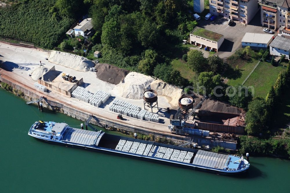 Rheinfelden (Baden) from the bird's eye view: Port facilities on the Rhine in Rheinfelden ( Baden ) in the state of Baden-Wuerttemberg. The cargo ship transports the raw material aluminum 