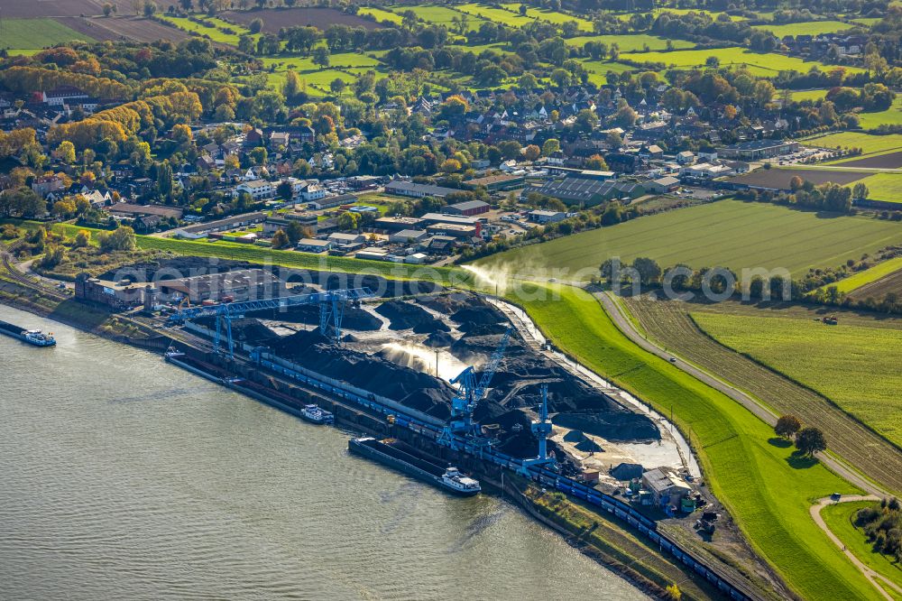 Orsoy from above - Port facilities of the coal port of zhe Niederrheinische Verkehrsbetriebe AG NIAG on the banks of the river course of the Rhine in Orsoy in the state North Rhine-Westphalia, Germany