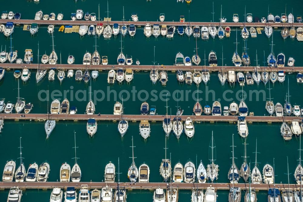 Port d'Alcudia from the bird's eye view: Port facilities on the seashore of the with moorings for sailboats in Port d'Alcudia in Balearic island of Mallorca, Spain