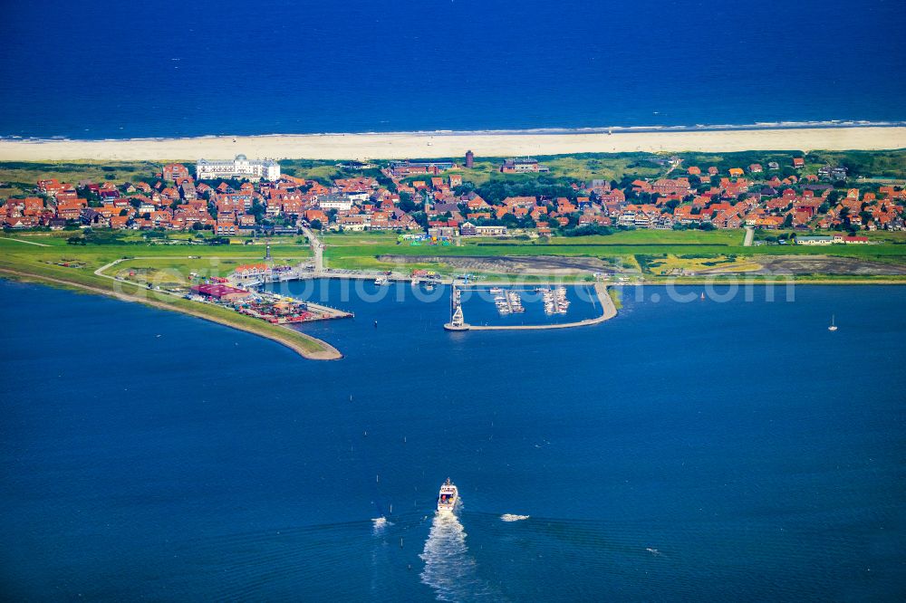 Juist from above - Port facilities on the North Sea island of Juist with the ferry Frisia VI in the state of Lower Saxony