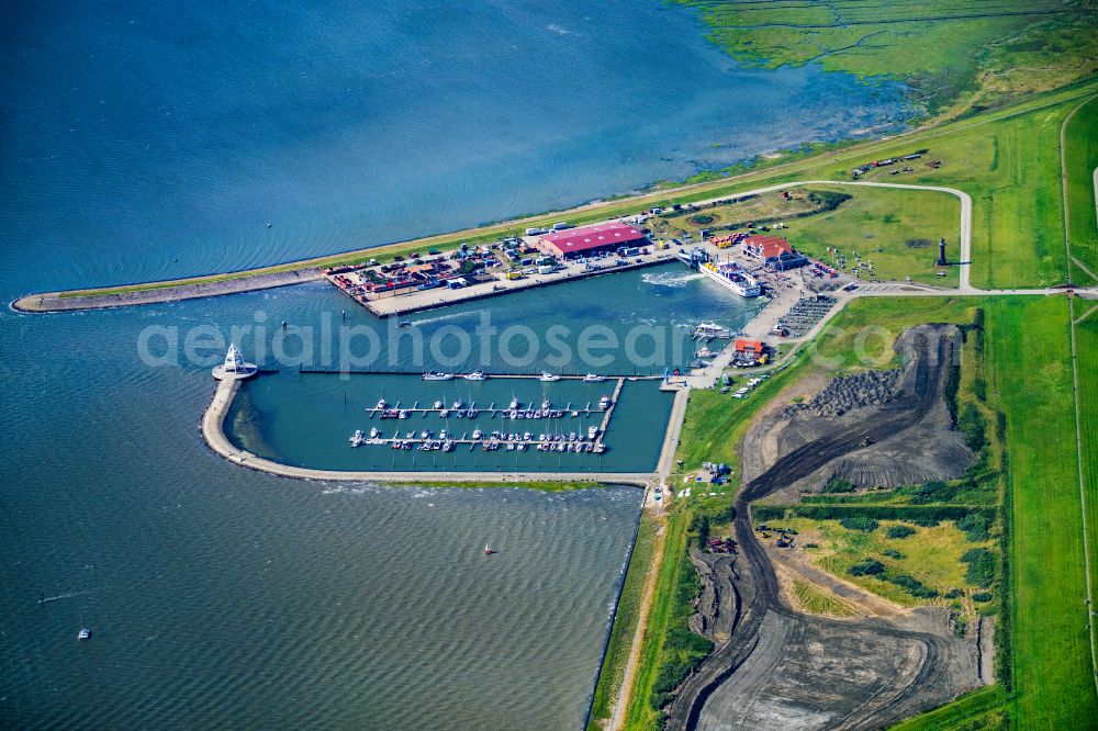 Juist from above - Port facilities on the North Sea island of Juist with the ferry Frisia VI in the state of Lower Saxony