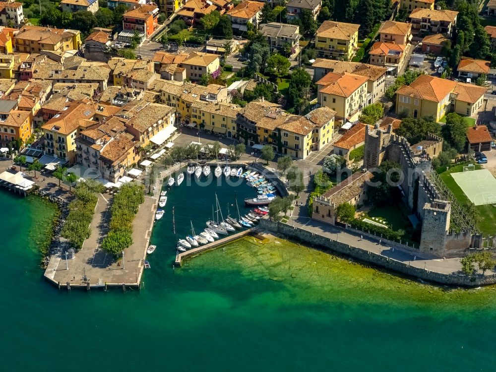 Aerial photograph Torri del Benaco - Port facilities Porticciolo of Torri del Benaco in Veneto, Italy. In the picture as well as the museum of Castello Scaligero