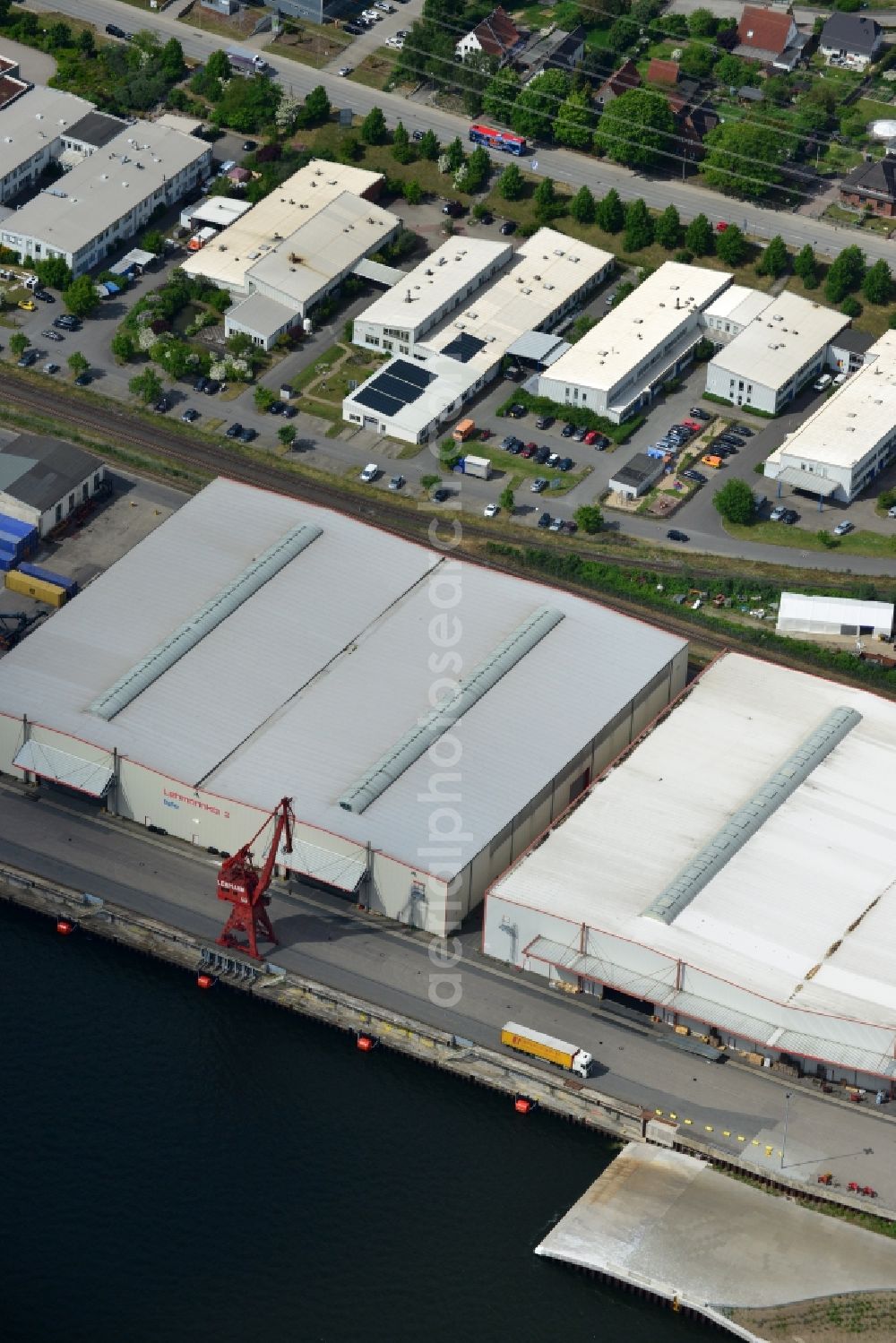 Aerial photograph Lübeck - Docks and terminals with warehouses and freight forwarding and logistics companies in Luebeck in the state Schleswig-Holstein