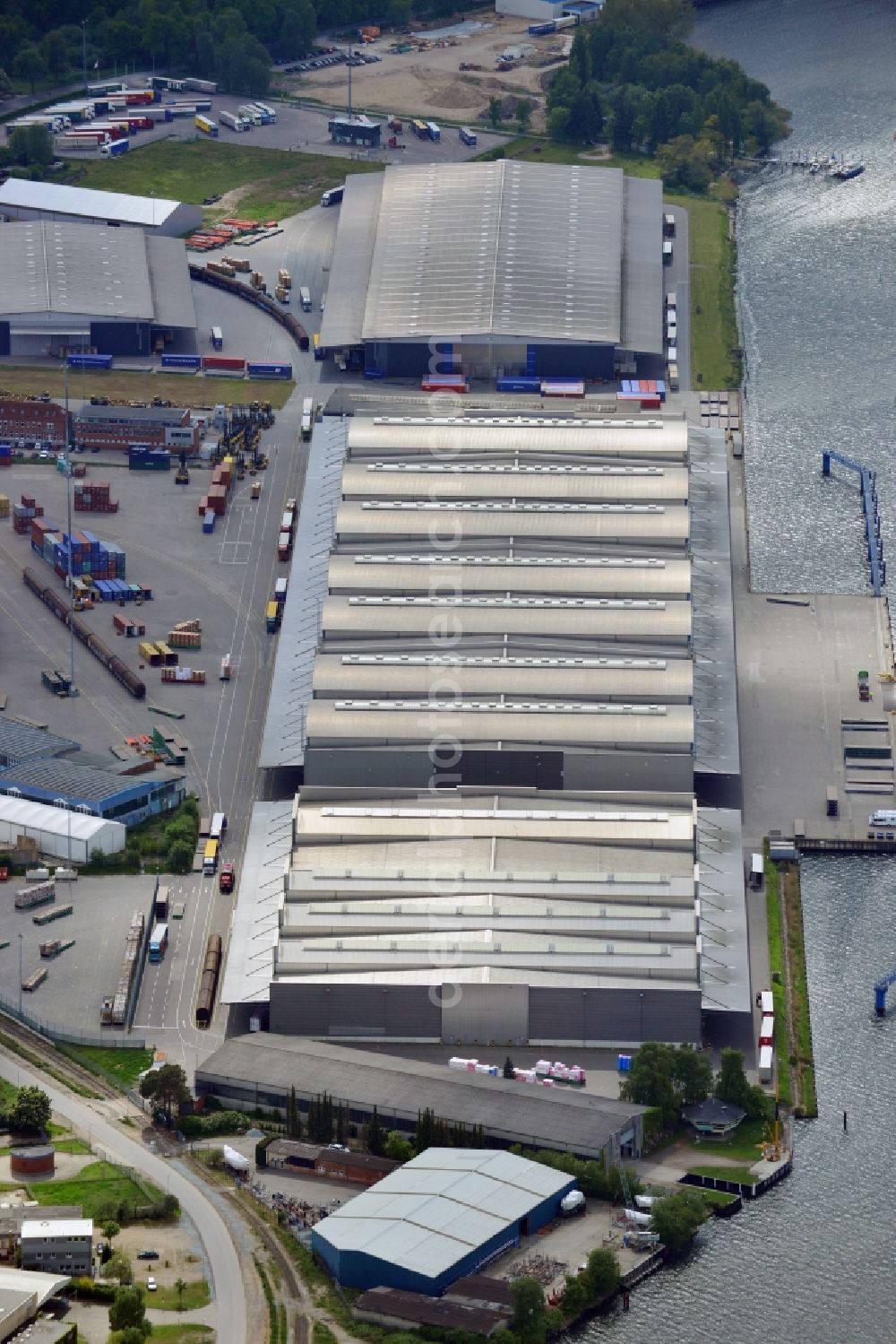 Lübeck from the bird's eye view: Docks and terminals with warehouses and freight forwarding and logistics companies in Luebeck in the state Schleswig-Holstein