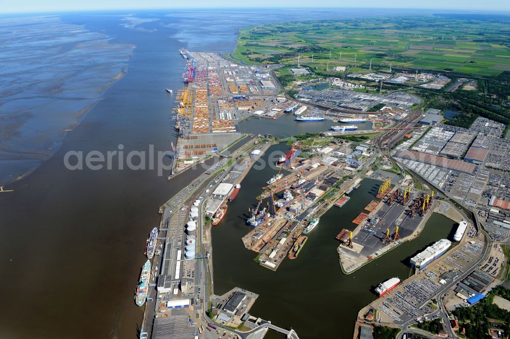 Bremerhaven from the bird's eye view: Docks and terminals with warehouses, freight forwarding and logistics companies and lots of containers by the mouth of the Weser in Bremerhaven in the state Bremen