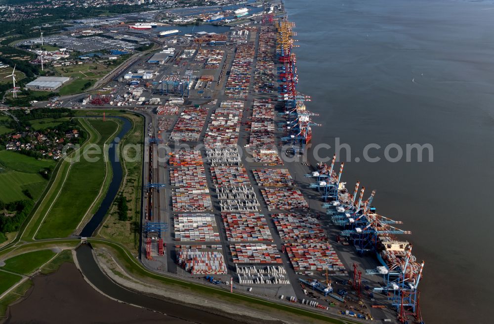 Aerial image Bremerhaven - Docks and terminals with warehouses, freight forwarding and logistics companies and lots of containers by the mouth of the Weser in Bremerhaven in the state Bremen