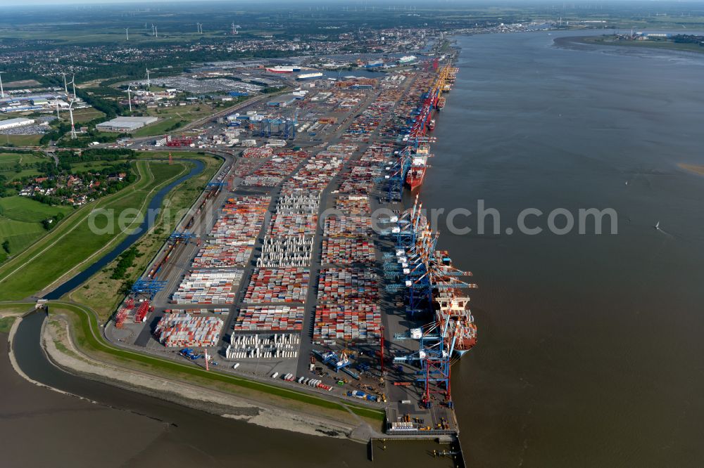 Bremerhaven from above - Docks and terminals with warehouses, freight forwarding and logistics companies and lots of containers by the mouth of the Weser in Bremerhaven in the state Bremen