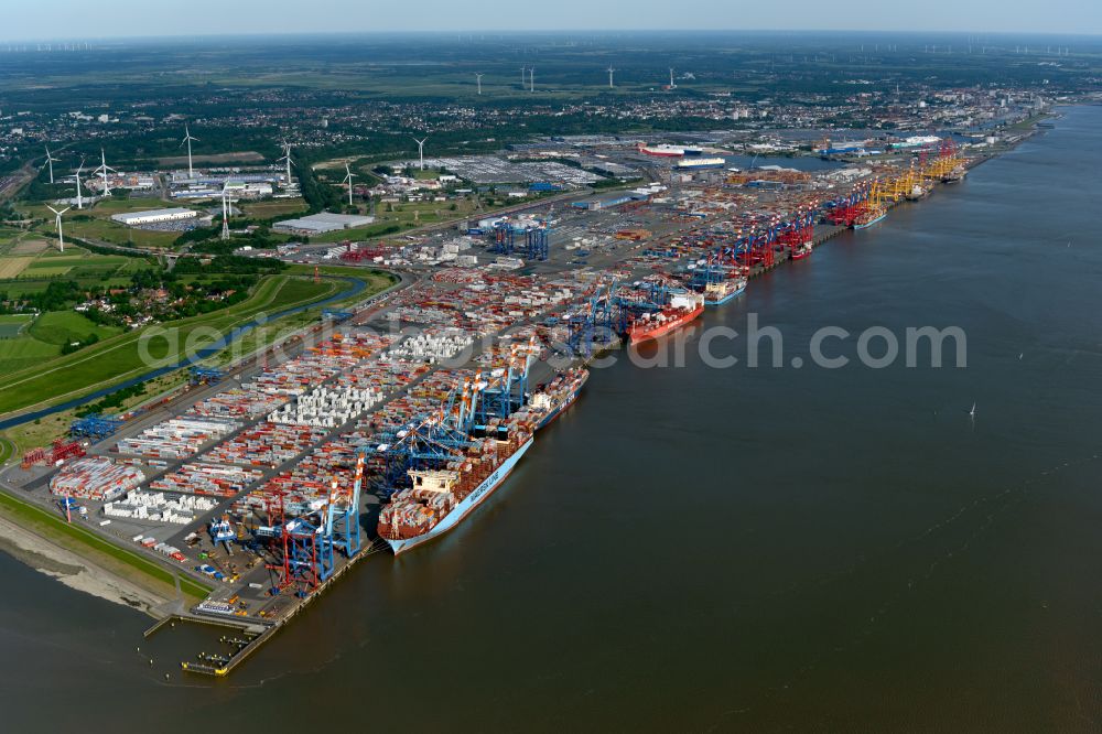 Bremerhaven from the bird's eye view: Docks and terminals with warehouses, freight forwarding and logistics companies and lots of containers by the mouth of the Weser in Bremerhaven in the state Bremen